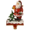 Christmas Central 6.5" Santa Holding Gift Box Christmas Stocking Holder 1 Christmas Central 6.5" Santa Holding Gift Box Christmas Stocking Holder -Christmas Decoration Store dnat rac bl80952 1 57947.1587645155